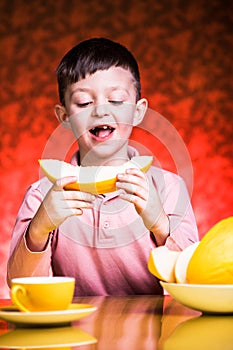 Boy eating melone