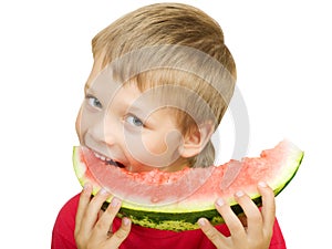 Boy eating a piece of watermelon