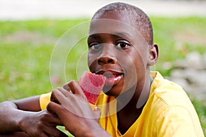Boy eating popsicle