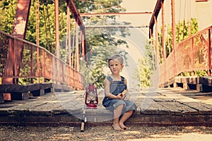 Boy eating sandwich taking break from fishing