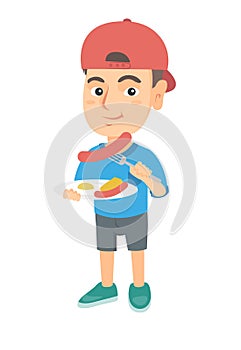 Boy eating sausage and fried egg for breakfast.