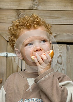 Boy eating Sour Fruit