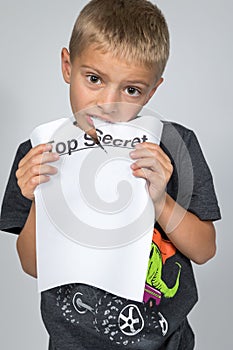 Boy Eating Top Secret Document