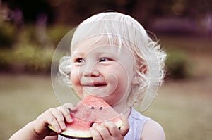 Boy eating watermelon