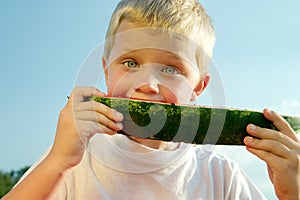 Boy eating watermelon