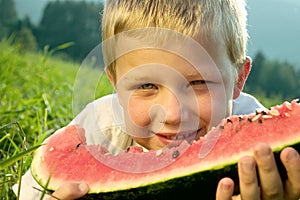 Boy eating watermelon