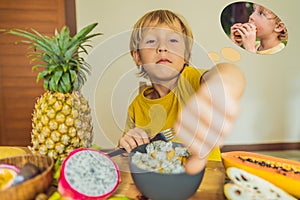 Boy eats fruit but dreams about hamburger. Harmful and healthy food for children. Child eating healthy snack. Vegetarian