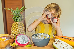 Boy eats fruit. Healthy food for children. Child eating healthy snack. Vegetarian nutrition for kids. Vitamins for