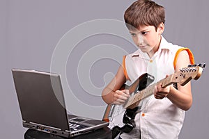 The boy with an electroguitar