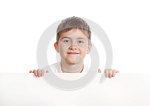 Boy emerge from behind poster photo