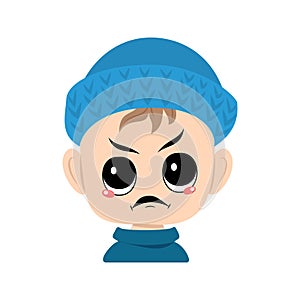 Boy with emotions panic, surprised face, shocked eyes in blue knitted hat
