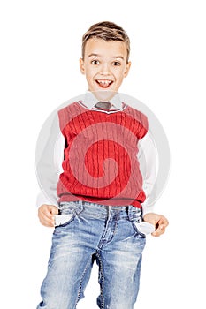 Boy with empty pockets against on white studio background.