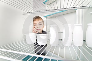 Boy and Empty Refrigerator