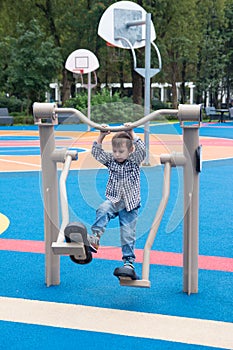 The boy is engaged in sports on simulators.