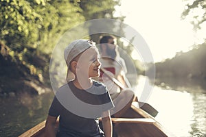 Boy enjoy canoeing time with his father
