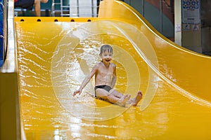 Boy enjoying water slide