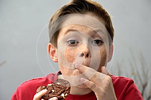 Boy enjoys pastry