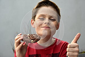 Boy enjoys pastry photo