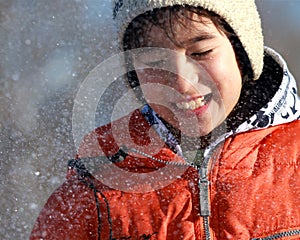 A boy enjoys a snow fight