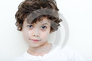 Boy of european and asian parentage smiles.