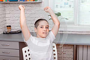 Boy excited expressing winning gesture, celebrating victory triumphant