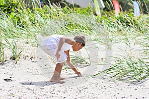 Boy exploring beach