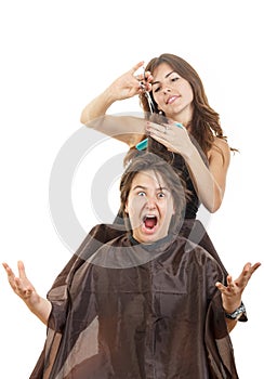 Boy with face expression with long hair at hairdresser