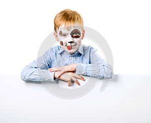 Boy with face painting like a dog