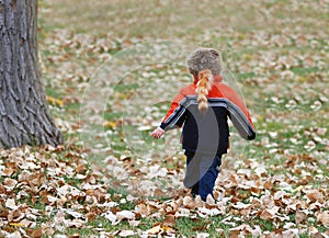 Boy in Fall Coonskin Cap
