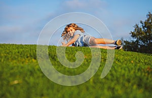 Boy falling down on grass. Kid falling off at the park.