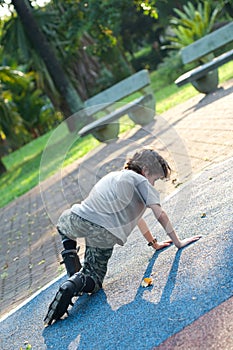 Boy falls over while rollerblading