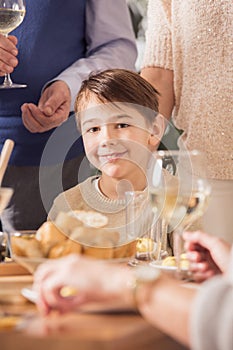 Boy at family dinner