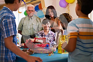 Boy With Family And Friends Celebrating Birthday Party