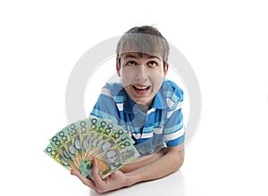 Boy with a fan of money banknotes