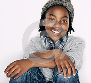 Boy, fashion and portrait with gen z, trendy and cool style with a smile in a studio. Child, happy and African male kid