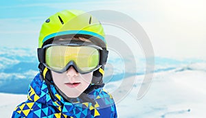 Boy fashion portrait with modern ski equipment on ski resort