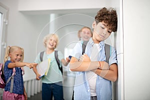 Boy feeling lonely and isolated suffering from bullying