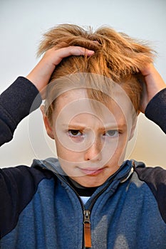 Boy feels misunderstood and pulls his hair