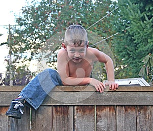 Boy on Fence