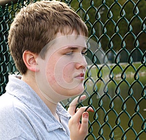 Boy in fence