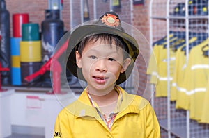 Boy in firefighter uniform