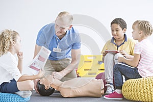 Boy with first aid instruction