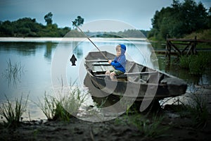 A boy is fishing