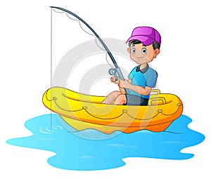 A boy fishing on the inflatable boat