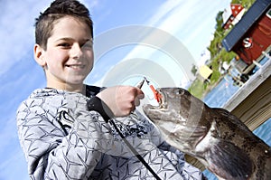 Boy and fishing trophy