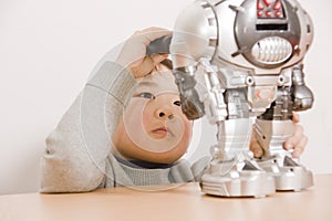 Boy fixing robot photo