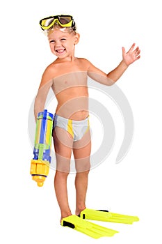 Boy in flippers and a mask with a water pistol