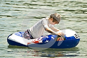 Boy on a Float in the Water