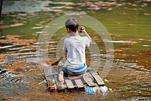 The boy floating on a raft