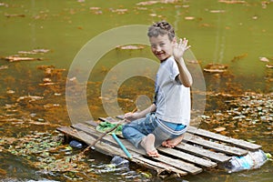 The boy floating on a raft